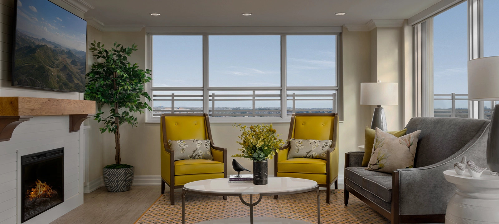 Amica Taunton's lounge, which has a fireplace and two big yellow chairs. Updated for text overlay.