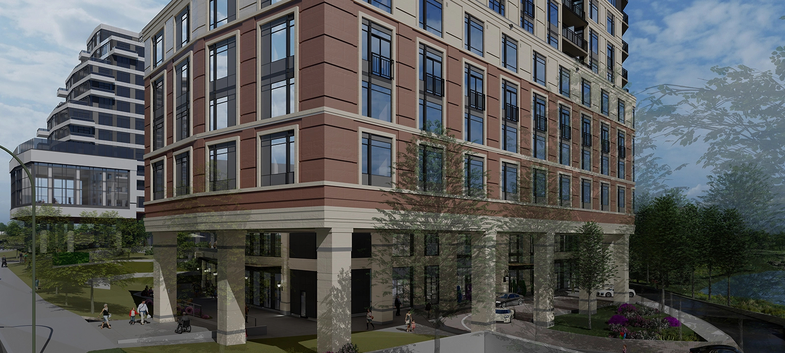 An exterior shot of Amica Credit Mills, a mid-rise two-coloured building surrounded by trees.