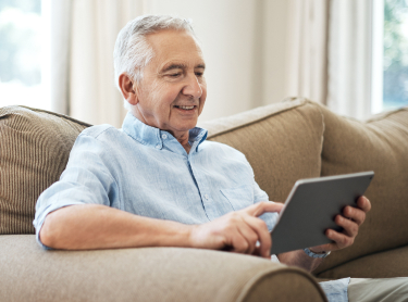 Senior-Male-looking-at-ipad-Mobile-Banner Senior-Male-looking-at-ipad-Mobile-Banner