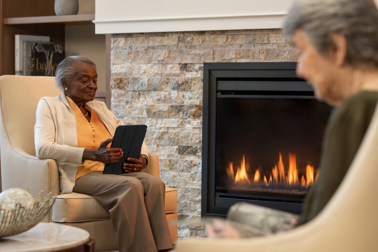 Senior women reading on their ipad Senior women reading on their ipad