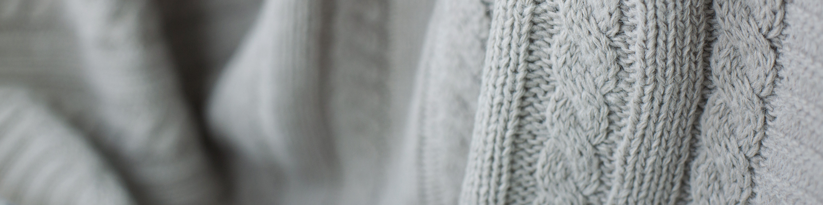 Close up photo of a grey knitted sweater at Amica senior living residence.