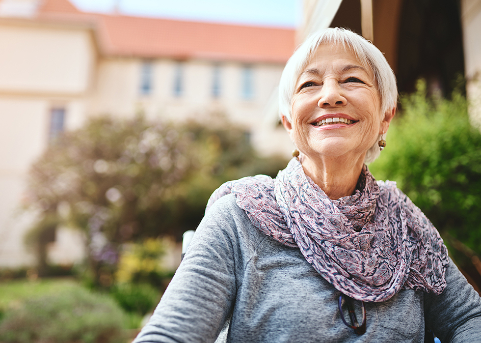 Shot of a senior woman relaxing outside in the garden of a retirement home.