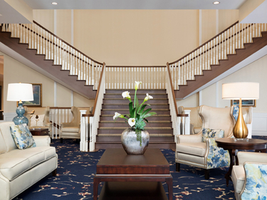 Lobby entrance beside a staircase.