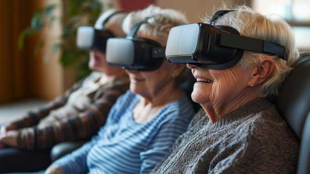 Senior women laughing happily while using VR headset.