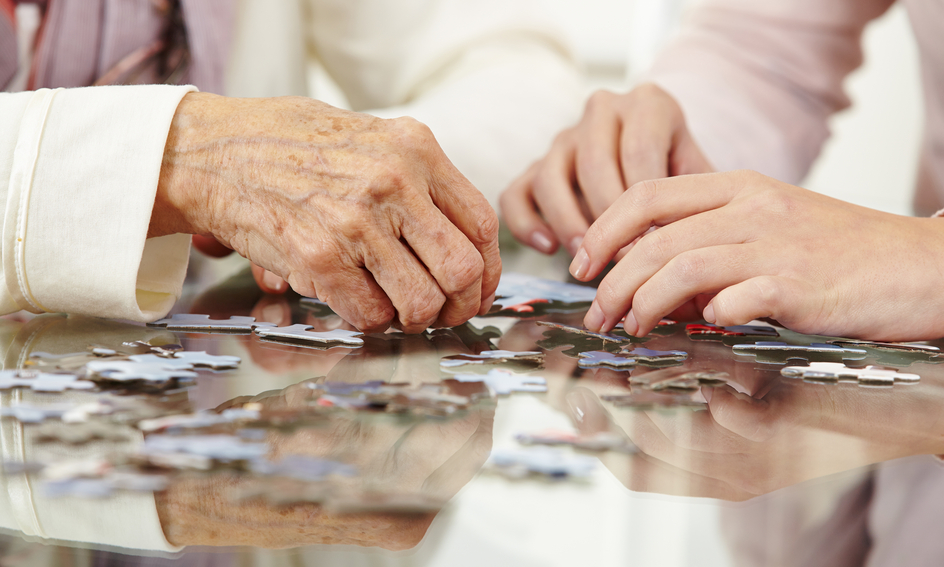Image for Conversations Article Know common forms of dementia in seniors. Amica seniors playing puzzle.