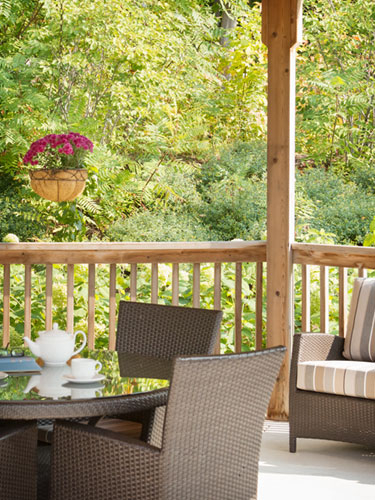 Outdoor terrace with tea set at Amica Little Lake senior living residence.