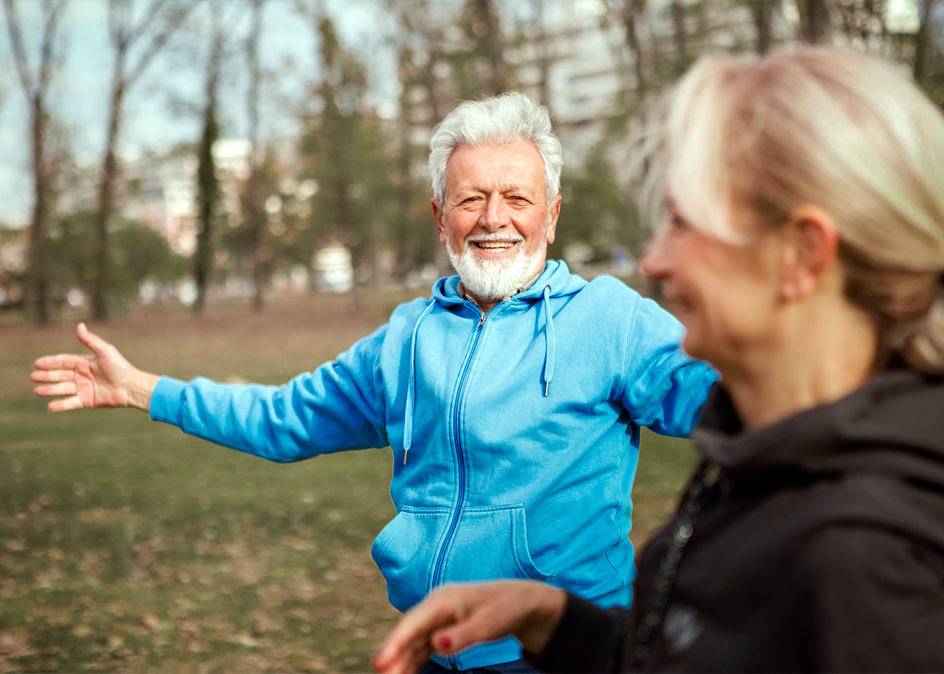 Senior couple exercising in a park