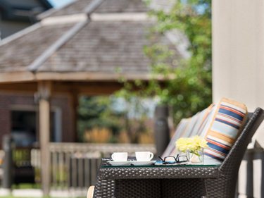 An image of the patio chairs, with a gazebo in the background at Amica Stoney Creek.