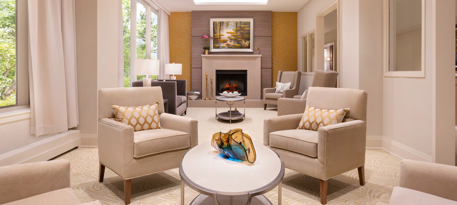 The renovated Swan Lake lounge includes luxurious seating with a fireplace at the heart of the room.