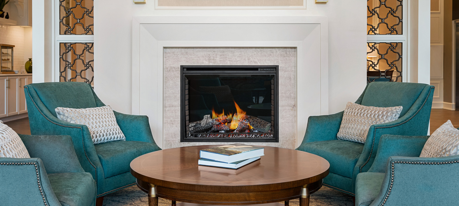 Image of Amica Glebe lounge with green chairs and fireplace (overlay over image so text can be overlaid on it).