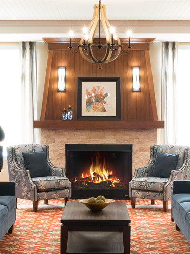 Fireplace lounge at Amica Stoney Creek senior living residence.