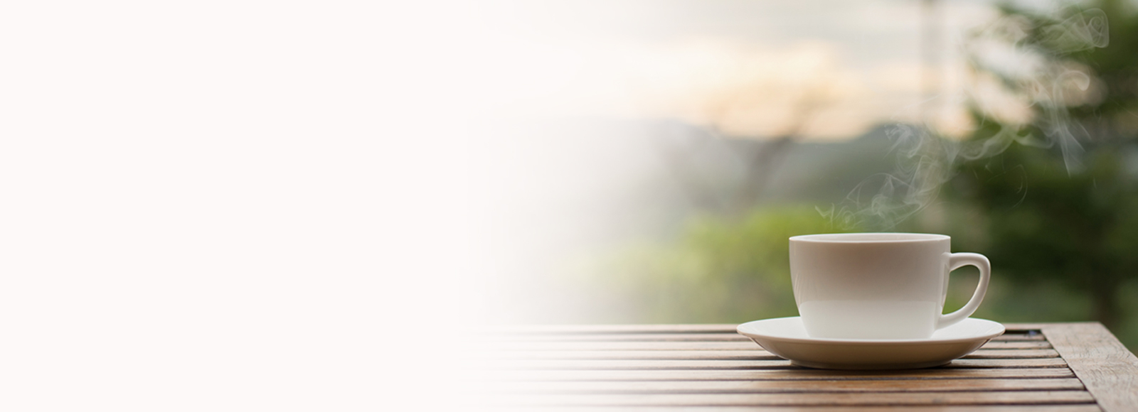 Dif1600x580_Conversations Coffee cup on the right side with blurred left side at Amica senior living residence.