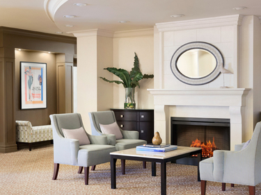 Fireside lounge at Amica Whitby senior living residence.