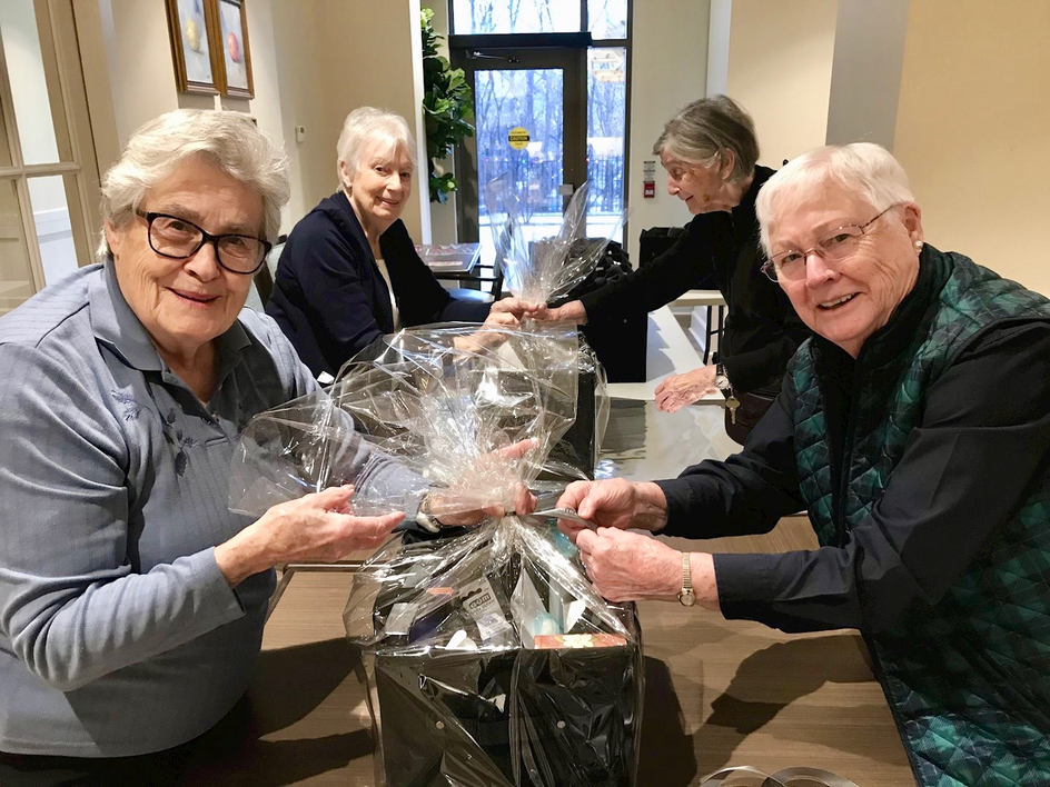 Amica Georgetown seniors prepare holiday baskets for Amica Helping Hands to support local seniors in need.